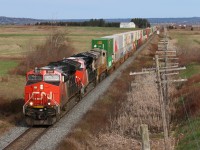 CN Q120 is seen in its entirety crossing from NB to NS with 3031 on the point leading 464 axles to the Port of Halifax 