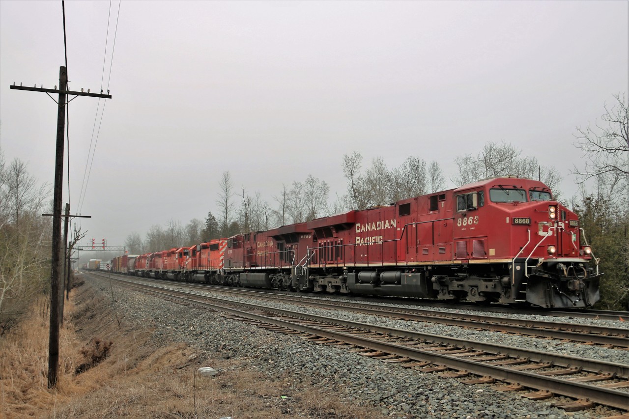 As is typical, the good trains come in the bad weather. Its cold, misty with a slight fog rolling in as a quartet of SD40-2's take their final ride southward. CP 5939, CP 5900, CP 5961 and CP 5932 hitch a ride on CP 246 with CP 8868 and CP 8750 providing the power as it departs the Galt sub and heads down the Hamilton sub at Twiss Road in Campbellville.