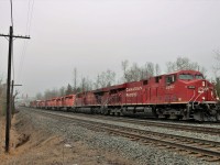 As is typical, the good trains come in the bad weather. Its cold, misty with a slight fog rolling in as a quartet of SD40-2's take their final ride southward. CP 5939, CP 5900, CP 5961 and CP 5932 hitch a ride on CP 246 with CP 8868 and CP 8750 providing the power as it departs the Galt sub and heads down the Hamilton sub at Twiss Road in Campbellville.