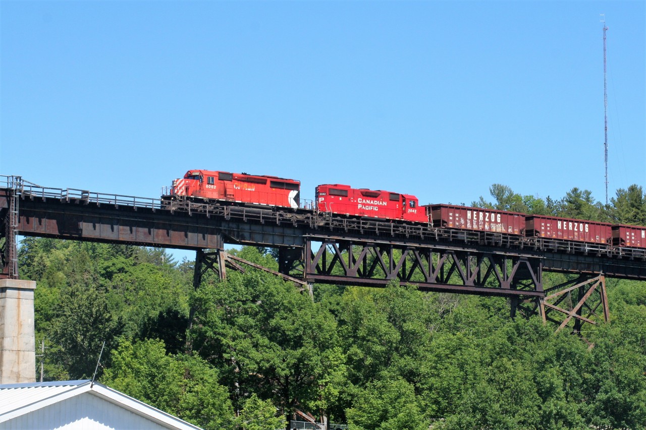 At the start of 2018, if someone had said that I would have the chance to photograph an active CP SD40-2 again I would have had my doubts. Well, flash forward to summer and having just arrived in Parry Sound on a family vacation, putting aside some time to witness one of these iconic GMD's leading a northbound was an easy decision. CP 6062 and 3042 are viewed leading an empty northbound Herzog ballast train, destined for Sudbury, under historic Tower Hill and onto the 1695 foot CP trestle bridge over the Seguin River and the Parry Sound harbour. Thank you to Stephen C Host for the heads-up and the information on this train that day.