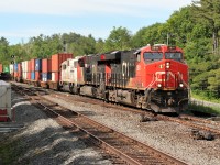 CN train 112 heads southbound through Boyne, just outside of Parry Sound, Ontario on the Bala Subdivision. Powering the train are CN 2811, CN 3118 and CEFX 6002, which is former SOO Line SD60 6002. 