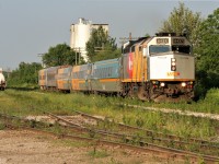 A very colourful VIA Rail #87 approaches Lancaster Street in Kitchener with 6437 leading a mix of coaches. 