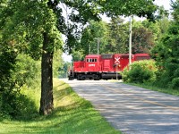 Canadian Pacific train T69 crosses Milburough Line just west of Campbellville as it approaches Guelph Junction. 