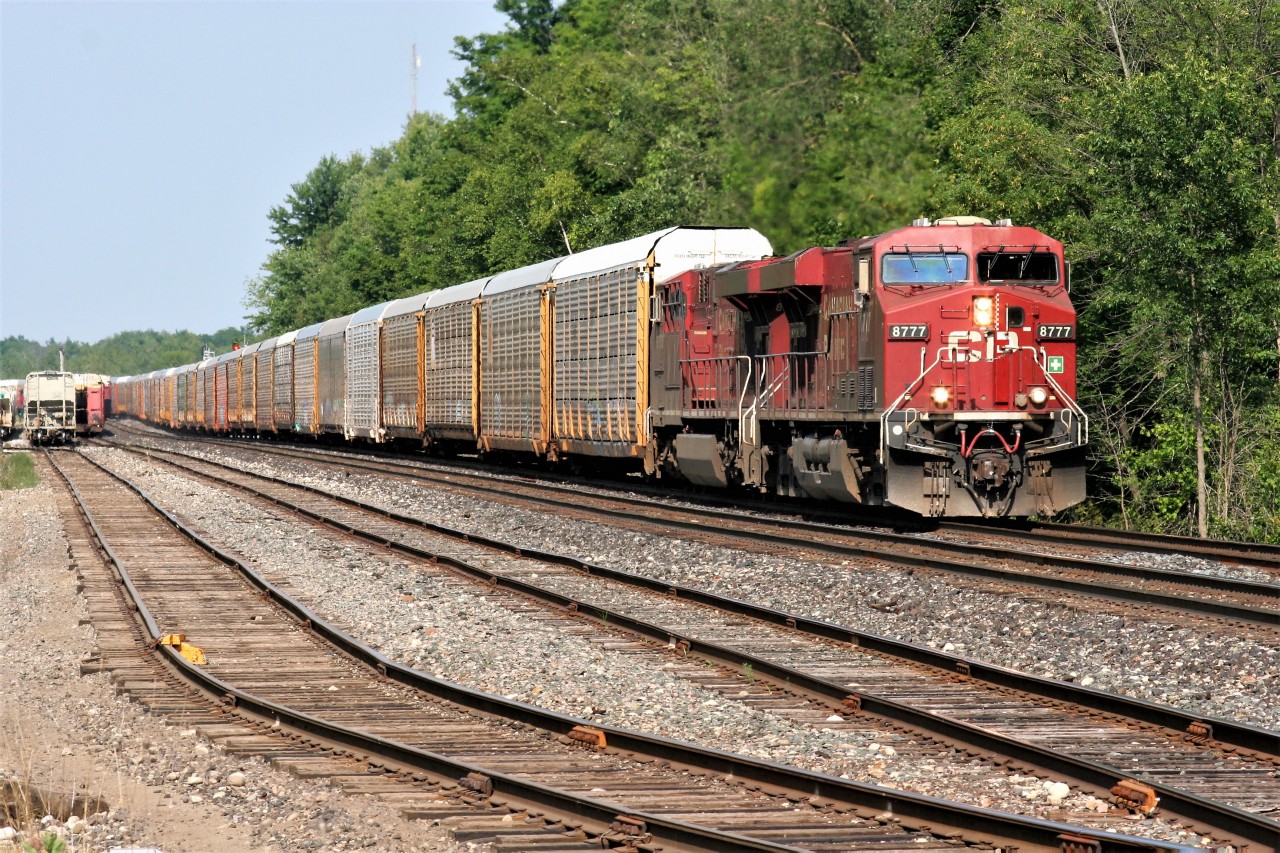 CP 8777 and 8750 are leading train 147 through Guelph Junction on a hot summer evening.