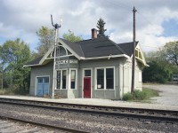 Here's the quaint little station at Maple, before it became a marked GO stop. A rural station out in the countryside. But oh how times have changed.
Commuter service was introduced in 1974 with the start up of the Toronto-Barrie run.
This line was originally Ontario, Simcoe & Huron railway company. This station was built after 1905, when the first one was destroyed by fire; the result of a 'corn-field meet' almost in front of the old building.
South end of the Namesign shows "Toronto 18 miles" and the north end, "North Bay 197 miles". Interesting feature unique to Grand Trunk, I believe.
For those interested, this would make a good subject for "time machine".