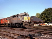 Quebec, North Shore & Labrador SD40 204 (now owned by CP) and CP M636 4729 head up a westbound freight past the station in Woodstock, about to take their trainorders on the fly (see photo <a href=http://www.railpictures.ca/?attachment_id=36390><b>here</b></a>). CP purchased 15 SD40 units secondhand from QNS&L in 1985, and they operated for a bit in their former owner's colours until receiving Action Red paint and being renumbered into the CP 5400-5414 group.
