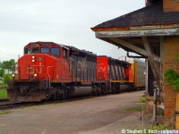 A nice pair of SD40-2w's framed in the CNR Ingersoll station. Is this thing still standing?<br><br>
In the good 'ol days, lots of EMD power on many trains and this was no surprise, just a regular run of the mill train that I was in the hood for , probably a single train or two before I kept going to Sarnia for an in-laws visit.