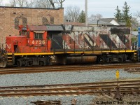 CN may have some really ugly units. We've seen a few posts of them - and feel free to post your findings. But let's be brutally honest - CN has the best roster of any Class 1 in North America right now. Period. Despite implementing (and Pioneering) PSR on a Class 1 we still have a lot of good stuff in both the six axle and four axle worlds. Generations of power. Some of it is also really UGLY. I don't like ugly stuff, I never have.. but I enjoy what is here and shoot things as they lie (Like in Golf).<br><br>
So what's this then? CN 4726. It's a Zebra. It's Noodle. Zoodle perhaps? Really needs a lick of paint is all I know but for now, it wears both schemes. <br><br>
Discussion for the locals - this was parked in Guelph on 542.. which is happening regularly now - they didn't make it to Cambridge three times this week and parked in Guelph! Also 542 is going to nights starting this weekend I'm told. Get your shots.. oops, too late, it's a night train now. We'll see how long that lasts.