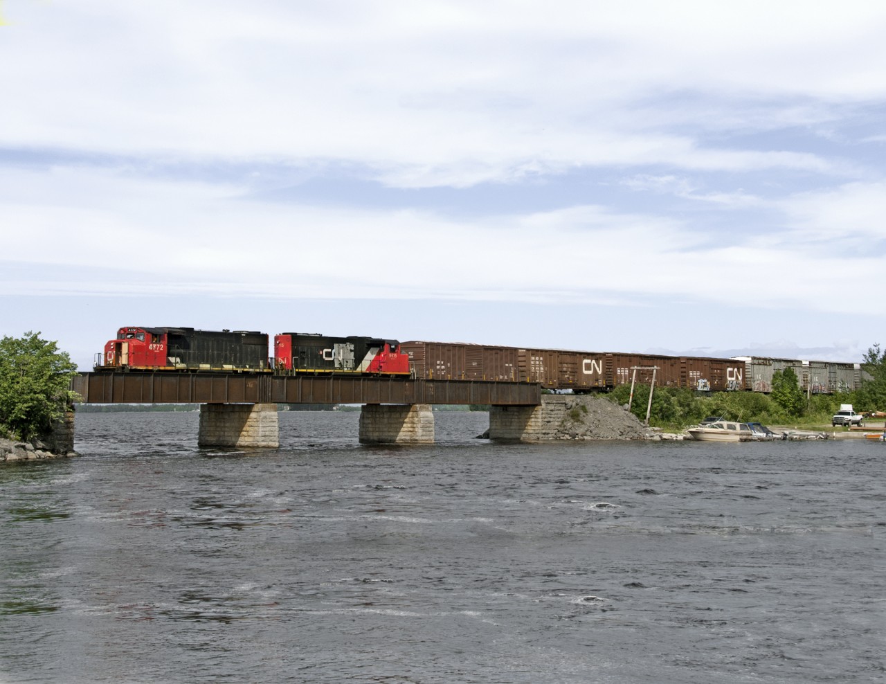 Westbound La Dore turn out of Chambord crosses the Ouiachouan River at its mouth with Lac St. Jean