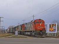 <b>ACTON.</b>

November 15, 2018 marked the end of an era, being the last day of the GEXR operations on the Guelph sub. This brought a lot of nostalgia for the awesome way the GEXR ran there operations through the years, true railroaders and railroading at its best. Next came the excitment of the new era being ushered in with the blue GATX leasors, daylight 431s and GMD-1s (rhyming is incidental, haha). 
<br>
<br>
Not too often thought about, for me at least, is the era before GEXR when CN tamed the Guelph Sub. Combing through more of Norm Conways collection, has revealed that he caught the Acton action, and in the early twilight of CNs MLW fleet. 
<br>
<br>
Acton is a very interesting place for foaming. To the west, the relief from the ruling grade at Limehouse to the east. West of Acton, highway 7 provides a nice vantage and open area as proven by <a href="http://www.railpictures.ca/upload/gexr-431-crests-the-hill-at-acton-on-as-a-dodge-ram-paces-the-train-on-parallel-ontario-highway-7-some-courageous-artists-or-vandals-depending-what-side-of-the-spectrum-youre-on-painted-sp" target=blank>Mike Molnar's</a> and <a href="http://www.railpictures.ca/upload/gexr-431-climbs-acton-hill-with-5-emds-this-sure-sounded-nice" target=blank>AJS's</a> shots.
To the east, the grade at Limehouse make for a specacular show (I'm told), espcially with the second generation EMD power on the drawbar as seen by <a href="http://www.railpictures.ca/upload/with-the-motive-power-on-goderich-exeter-trains-431432-typically-the-same-most-days-the-challenge-becomes-finding-new-locations-and-different-scenery-the-stretch-of-track-between-limehouse-and-acto" target=blank>Marcus W Stevens</a>, <a href="http://www.railpictures.ca/upload/cngexr-431-makes-some-noise-as-they-attack-the-hill-coming-through-acton-with-cn-2416-on-the-point" target=blank>Cityslicker</a> and again <a href="http://www.railpictures.ca/upload/there-are-some-shots-that-just-can-not-be-done-on-a-sunny-day-between-acton-and-limehouse-there-are-a-few-locations-that-only-work-in-this-kind-of-lighting-conditions-in-this-shot-gexr-train-431-is" target=blank>Marcus W Stevens</a> shots. Not too long before Norms shot, <a href="http://www.railpictures.ca/?attachment_id=16428" target=blank>Bill Thomson</a> caught a westbound charging the hill with similar power.
<br>
<br>
The leader of the Eastbound Extra, CN 2305 built almost exactly 49 years ago in April 1970, is an M-636 that lasted on the rosted until mid-1990s. The younger cousin, HR 616 built by Bombardier in 1982 <a href="http://www.railpictures.ca/upload/the-aftermath-the-remains-of-cn-hr616-2105-are-seen-two-days-after-being-in-the-lead-of-train-272-when-it-was-involved-in-a-major-rear-end-collision-on-the-strathroy-subdivision-the-unit-was-on-the" target=blank>suffered a worse fate as seen here with Jason Noe's shot</a> 11 years later in 1995.