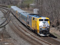 VIA's 40th anniversary is over. Now some silver and yellow VIA locomotives are running without emblems, including GE P42DC units VIA 913 and VIA 906, as seen in April 2019. 