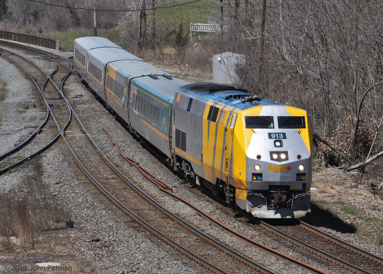 VIA's 40th anniversary is over. Now some silver and yellow VIA locomotives are running without emblems, including GE P42DC units VIA 913 and VIA 906, as seen in April 2019.