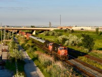 Under the fine looking evening sun on one of the longest night of the year, we find CN Intermodal 149 on the roll westbound with some goodies! Train has just departing the CN BIT moments ago and before the regular intermodel cars, we find a stack of 5 CN Buisness coaches! While I am not sure where they were destined for nor their purpose, it was a treat in general to be able see them and add them to my collection! The power was nice too, CN sd75Is 5701 and 5774! Both facing forward! Time is 19:49 and photo was taken directly on top of Bramalea road which is just east of the station! Highway 407 is the overpass half a mile or so away! 