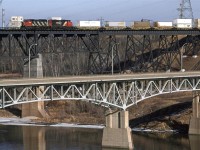 A less conventional view of CN's crossing of the North Saskatchewan River. The westbound lanes of the YellowHead Highway cross on this older steel bridge.
117 was probably the hottest train out west.