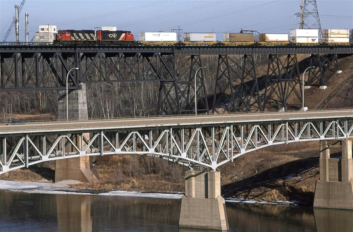 A less conventional view of CN's crossing of the North Saskatchewan River. The westbound lanes of the YellowHead Highway cross on this older steel bridge.
117 was probably the hottest train out west.