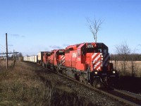 I was expecting a train from the north (eastbound)  as I had seen the day before and heard the two days before that, but this one came in from Smiths Falls, This is now a trail and the Carlton Place airport occupied the field behind the locomotives.