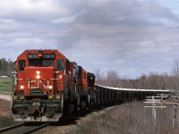 After showing off our kid to the in-laws in the Ottawa area, we flew to my folk's place in Halifax. There was a little time for train watching. 
By 1995, I guess the MLW's were not the dominating presence that they used to be. Here a big MLW is sandwiched by EMD products. At least the lead unit was not a wide nose. 