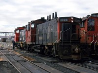 The Halifax Metro area was pretty relaxed about railfans (I suppose, as long as one behaved). A set of switchers is fueled as we look on. They may not be MLW, but they are likely on their last legs before newer larger engines get shuffled in as replacements. 