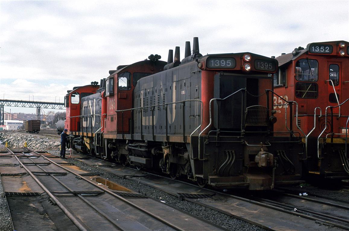 The Halifax Metro area was pretty relaxed about railfans (I suppose, as long as one behaved). A set of switchers is fueled as we look on. They may not be MLW, but they are likely on their last legs before newer larger engines get shuffled in as replacements.