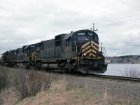 We decoded to make the trek to Glace Bay to show off our kids to their great grand mother. This allowed me a chance to look for the CBNS. I must have read somewhere that they had a train come into town about this time of day (CTC Board, most likely) since I only had to wait a few moments before the train appeared.
This is my one and only photo of the railway. We try for more photos by looking around the Sydney terminal and saw nothing at all (I don't know where this train went). During our look around the area, we did try to spot DEVCO, but I have no idea whether they were still operating at that time.