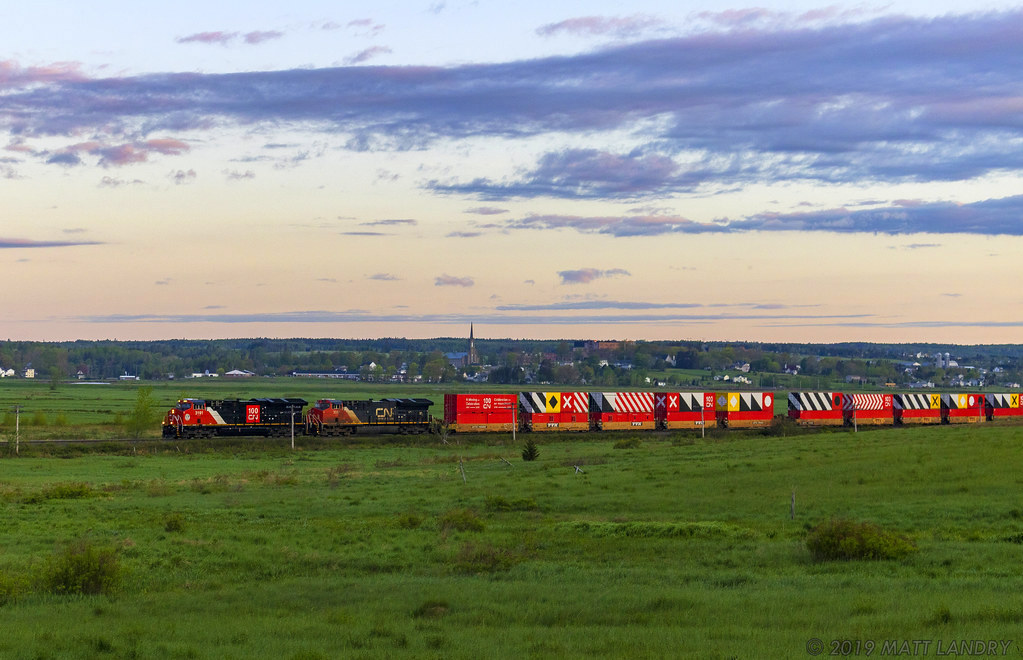 CN 3191 leads Q120 eastbound at Memramcook, New Brunswick, with the celebration CN 100 containers near the head end. They are destined for the next show at Halifax, Nova Scotia for next weekend. CN 3191 is also on the head end with the CN 100 scheme, a nice touch.