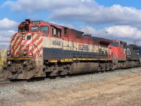 BCOL 4644 has just come in off the Wainwright Sub. and is now setting off some tailend autoracks into Clover Bar yard before continuing the trip south to Calgary. Nice having the red, white and blue leading and although with those windows, the 4644, built in 95, is a little younger than the 2167. The 2167, formerly ATSF 811 and built in 92, has the older GSC/Adirondack trucks and a Sante Fe gull wing cab roof.