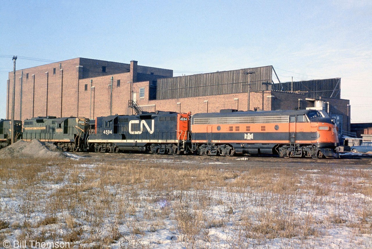 CN-leased Bessemer & Lake Erie F7A 720A sits coupled to CN GP9's 4594, 4600 and an RS18, sitting by the huge Ice House (for icing refrigerator cars) northeast of the Mimico Yard roundhouse.

Today, the site of CN's old ice house is home to VIA's Toronto Maintenance Centre building. CN eventually rebuilt their old high-nose GP9 fleet as chop-nose units for roadswitcher and yard work. B&LE 720A also still exists, currently owned by the Grafton & Upton RR as their 1501.