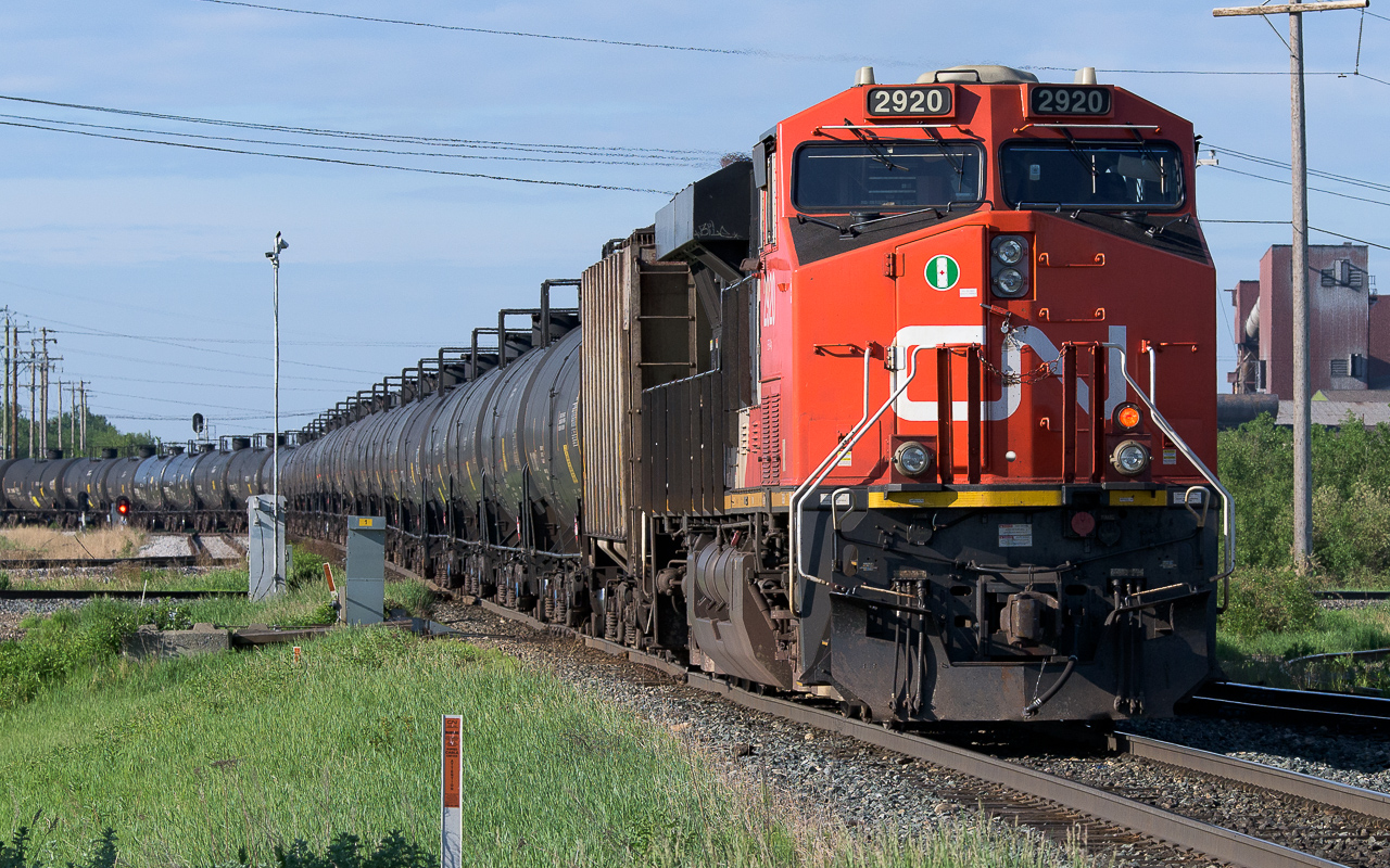 2920 brings up the tailend as the last of the empty oil can train rolls into Kinder Morgan. Of interest is the time it takes to get a freshly loaded train back out of there. When I was watching earlier this morning, it really is a round and round as they make their way through the crossovers and finally out. Almost reminiscent of an open pit mine.