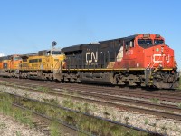 CN 2970, GECX 9411 and PRLX 257 are coming up the hill to Clover Bar with a long train of loaded auto racks.