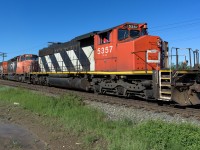 The 5357 has it's train of tanks on the move out of the East Edmonton siding to finish the last leg of the trip to Walker yard. The puddle notes the very heavy rain in the area just before Father's Days last year. Oddly enough, same thing this year, just after Father's Day. Both rain gauges in the backyard caught 40mm in the last 24hrs. Get those lawnmower's ready.