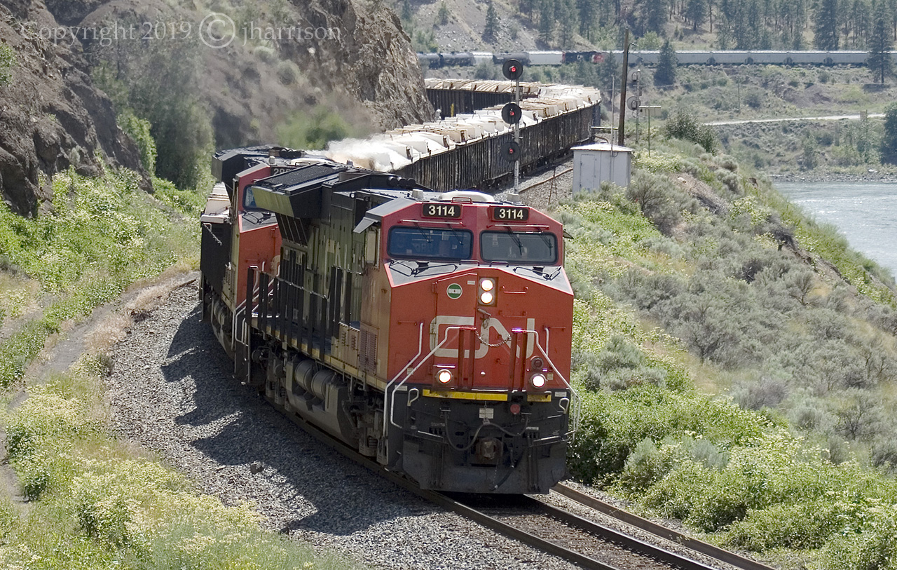 CNXE 3114 with the 3164 at MP 78 SNS Drynoch. Farther back in the scene is DPU CN 3164.