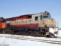 Canadian Pacific C424 4200 (the former CP 8300) is pictured still sporting her faded maroon & grey script livery, with CP GP35 5006 on the head end of a freight at Bolton on March 25th 1972.
<br><br>
As an initial one-unit sample order, CP's first C424 (and the first C424 ever built by MLW or Alco) had a few differences from other CP units, including the fuel tank, dynamic brake hatch, rear radiator style, hood details, battery boxes around the cab, deck-mounted stanchions, and a higher-mounted headlight that was originally on the flat plate of the cab (4201-4209 were also delivered with high-mount headlights, but units 4210 and over had it on the nose). In the mid-late 60's, the early units with high headlights all had them relocated to the nose, as seen here.