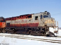 Canadian Pacific C424 4200 (the former CP 8300) is pictured still sporting her faded maroon & grey script livery, with CP GP35 5006 on the head end of a freight at Bolton on March 25th 1972.
<br><br>
As an initial one-unit sample order, CP's first C424 (and the first C424 ever built by MLW or Alco) had a few differences from other CP units, including the fuel tank, dynamic brake hatch, rear radiator style, hood details, battery boxes around the cab, deck-mounted stanchions, and a higher-mounted headlight that was originally on the flat plate of the cab (4201-4209 were also delivered with high-mount headlights, but units 4210 and over had it on the nose). In the mid-late 60's, the early units with high headlights all had them relocated to the nose, as seen here.