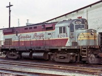 CP C424 4204 is shown still in her as-delivered maroon & grey script livery at the Quebec St. yard in London in September 1972. A replacement horn in the current action red paint is a sign that her days in the old script livery are numbered. 4204 was also one of the few units originally delivered with high-mounted headlights (4200-4209) that later had them lowered to the nose.
<br><br>
After retirement in the 90's, CP 4204 was sold to the Ottawa Central Railway, and today survives stored on the Morristown & Erie.