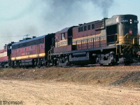 CP RS10 8571 leads a leased SOO F7B unit and CP SW1200RS 8127 on an extra freight over CN at Port Credit in 1964. Note the beaver shield mounted on the front end of 8571: all CP hood units equipped with steam generators for passenger service originally had a small beaver shield applied to their front ends. The SOO B-unit trailing was one of a number of SOO F-units leased by CP in 1963-64.<br><br>More SOO F-units leased by CP: <a href=http://www.railpictures.ca/?attachment_id=15563><b>http://www.railpictures.ca/?attachment_id=15563</b></a>