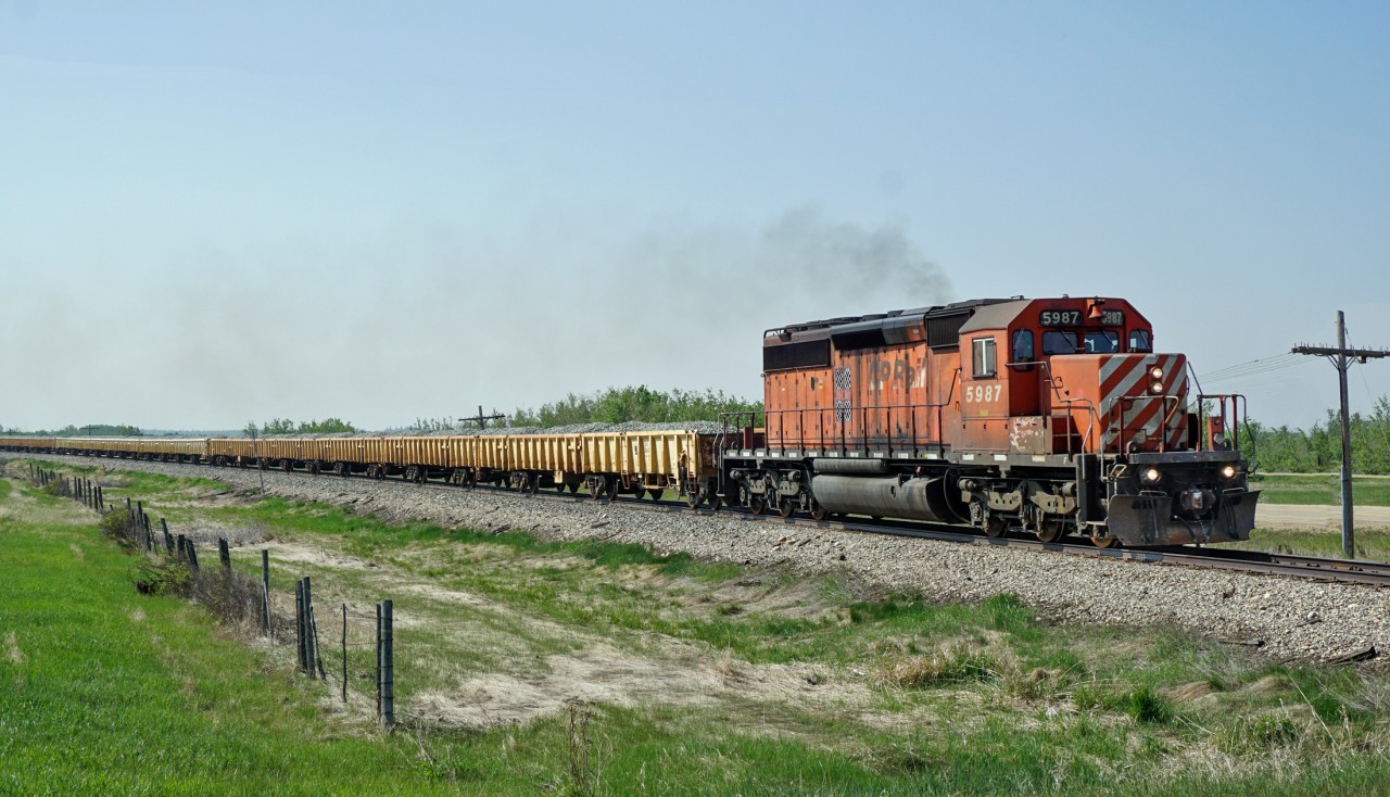 SD40-2 CP 5987 heads a ballast train north between Millet and Kavanagh at MP 70.9 of the Leduc Sub.