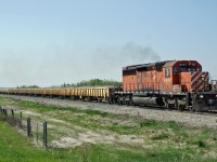 SD40-2 CP 5987 heads a ballast train north between Millet and Kavanagh at MP 70.9 of the Leduc Sub.