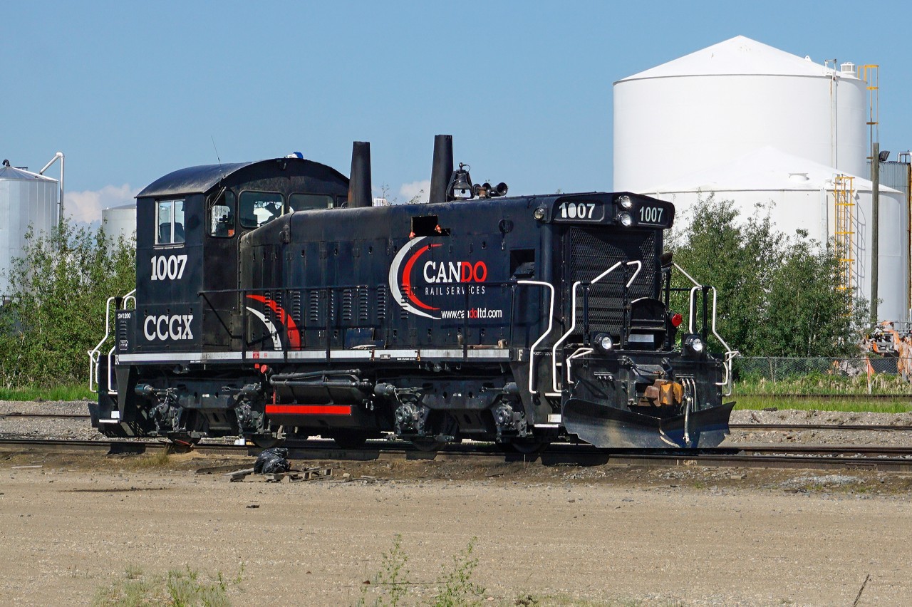 Switching duties at the ESSO refinery in East Edmonton are handled by Cando Rail Services.  Here their SW1200RSu CCGX 1007 sits on th esiding just off CN's Camrose Sub