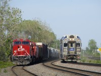 It's a meet at slow speed as CP 119 at left backs up so that it can perform a tail end lift at the Lachine IMS Yard, while EXO 55 at right is heading towards its next stop at Dorval.