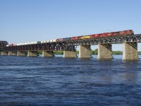 CP 253 has 6 units (CP 8600, CP 8126, CP 8925, UP 3911, CP 8016 & CEFX 1032) and 77 cars as it crosses the St. Lawrence River towards Montreal on a beautiful morning.