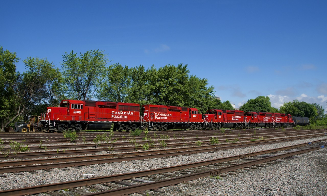 CP F94 has five units and only one car as it passes the empty and weed strewn Lasalle Yard. The last two units will be set off at Delson and the single tank car is going to Napierville.