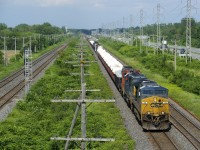 CN 327 has CSXT 114, CSXT 8842 and CN 9547 for power and 84 cars as it prepares to leave the island of Montreal.