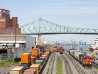 CN 7075 & CN 7229 are doubling their train in the Port of Montreal before heading back to Pointe St-Charles Yard. At left are long lines of containers and the Molson brewery, which will soon be moving to the South Shore. 