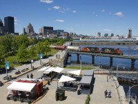 CN 7229 and CN 7075 are crossing the Lachine Canal as they exit the Port of Montreal with a transfer.