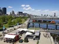 CN 527 with CN 2233 & CN 8853 is heading towards the Port of Montreal light power to pick up some cars. It is following the Pointe St-Charles switcher, which had just passed here in the same direction with 4 cars for the port.
