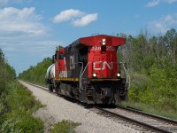 In the spirit of out-of-place looking, long hood forward GEs (following up on Marcus Stevens' <a href="http://www.railpictures.ca/?attachment_id=37814">shot from this past weekend</a>), here's CN 2528 operating as L562, running down the Humberstone Spur with one tank of chlorine for Vale. They would make the set off and return to Port Rob light power. <br><br>Though still a couple of kilometres or so from what I would consider the urban boundary, this shot at the Third Concession Road crossing is technically still considered Port Colborne. 