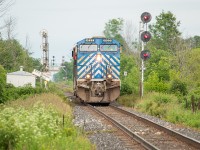 The other day I posted <a href="http://www.railpictures.ca/?attachment_id=37882">a shot of CP</a> coming off of the Hamilton Sub and onto the CN Stamford Sub at CN Robbins, well here is a picture of CN L562 coming off of the Hamilton Sub and back onto the CN Stamford Sub, except this is the west leg of the connecting track at CN Robbins West. After making a rather large setoff at Feeder (I'd say at least 40 cars), the crew of 562 went back to Port Rob light power and the CEFX 1023 led the way back home. As they were arriving at Feeder, it was rather interesting to see a CEFX unit trailing on a CN train on CP track. Oh the wonders of Niagara Region. <br><br>The setoff for Trillium was mostly grain hoppers for Port Colborne - presumably for ADM and/or the Port Colborne Grain Terminal. I believe traffic for the Robin Hood mill largely (exclusively?) originates off of CP and is only when the shipping season is closed. <br><br>You might think I am crazy for all of the railfanning I do in Niagara, and perhaps rightfully so. I do find all of the old odds and ends of track quite fascinating (i.e. fragments of the CASO, fragments of the Cayuga, etc.), and enjoy the regularity at which CP trains run on CN tracks, and vice versa. It also has the added appeal of the fact that the odds are usually in my favour of being the only one to catch any given movement, such as seeing this CEFX unit leading back to Port Rob. That certainly contributed to why I enjoy the area so much as well. And there are a lot of generally quiet places in which to railfan, away from the usual hustle and bustle. Which is a nice return to familiar surroundings for a guy who grey up in a small town and now lives in a city. <br><br>It was raining while 562 was at Feeder, but the clouds slowly gave way to the faintest amount of sunlight as it returned back to home territory, which I was grateful for. Of course, as I was driving back to Hamilton it was full sun the whole way. Figures. 