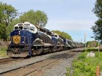 RMRX 8012 and 8014 head the Rocky Mountaineer east down the original Notch Hill line.  The track in the foreground leads around the grade reducing loop.