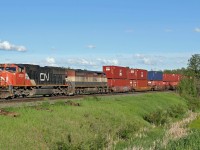 CN 5762 and BCOL 4617 are held at Lindbrook waiting opposing traffic