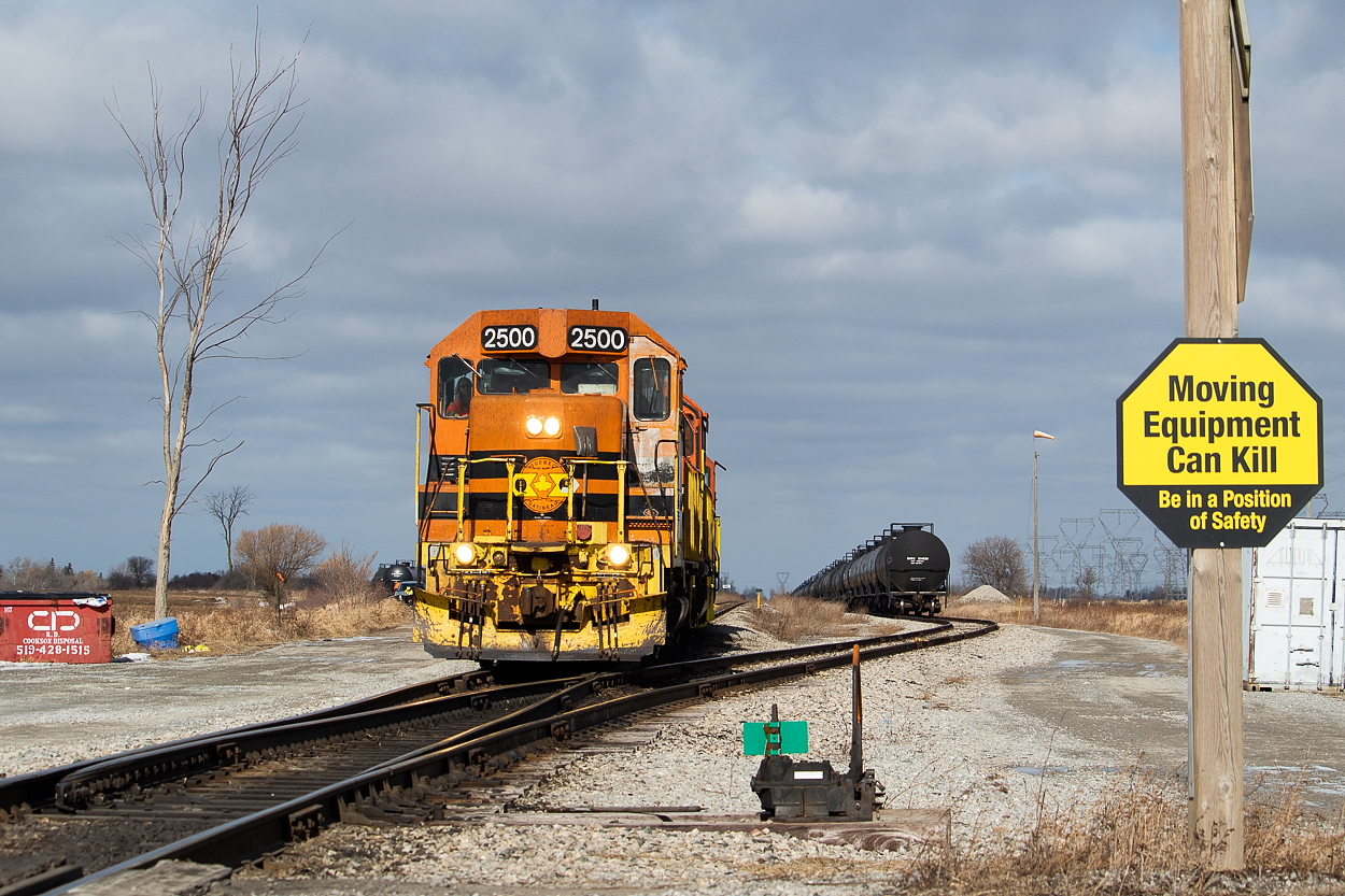 I really love the contrast of the G&W orange against a greay sky, so as I happened to be around the area on this February Saturday and noticed there was some sun breaking through the clouds (in what felt like a never-ending overcast Winter), I thought I would check in on the SOR. QGRY 2500 was on point in Garnet as they built the daily train for Nanticoke. The safety warning was a relatively new addition at the time.